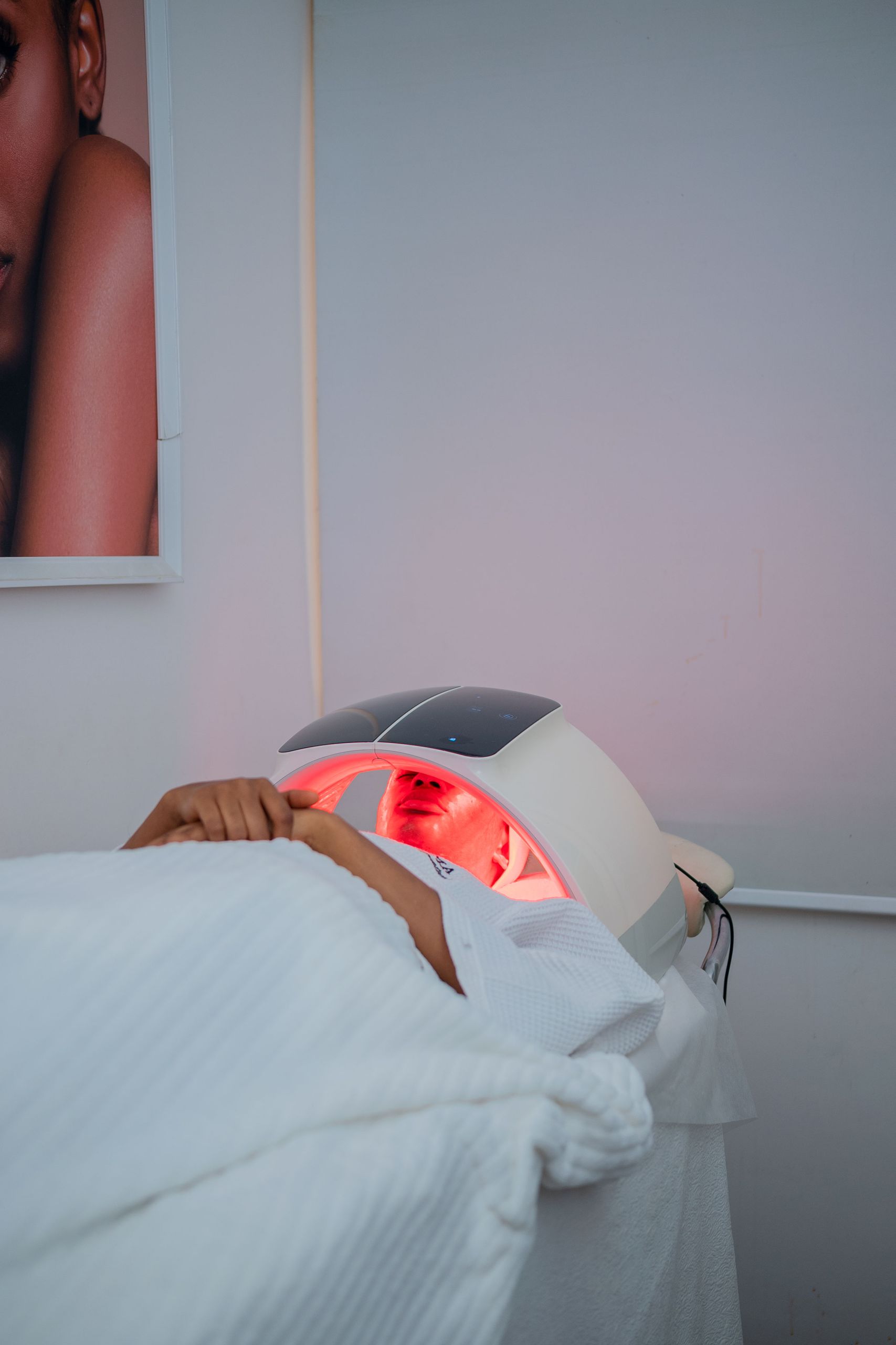 A relaxing LED light therapy treatment at a modern spa in Abuja, Nigeria.